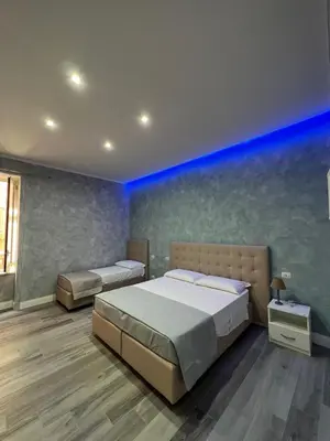 Letto o letti in una camera di Gioia Toledo