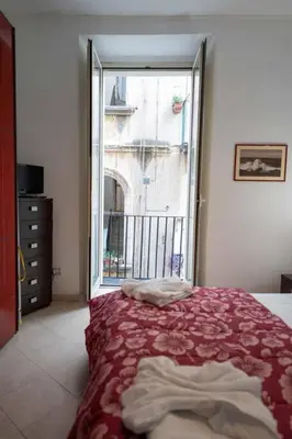 Letto o letti in una camera di Pazzariello House By Dimorra