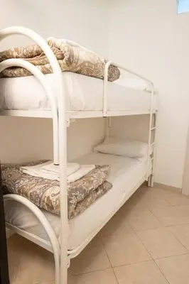 Letto o letti in una camera di Pazzariello House By Dimorra