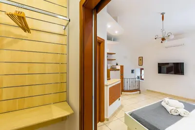 Letto o letti in una camera di Tolentino Studio Flat by Napoliapartments