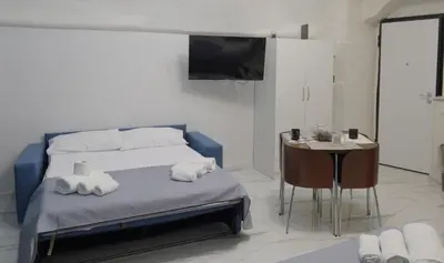 Letto o letti in una camera di Rebby Home