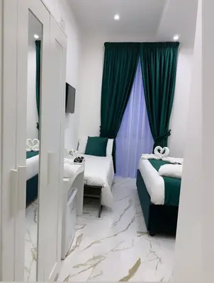 Letto o letti in una camera di Depandance Vania Napoli
