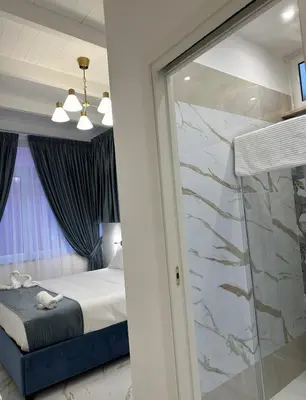Letto o letti in una camera di Depandance Vania Napoli