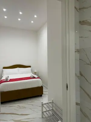 Letto o letti in una camera di Depandance Vania Napoli