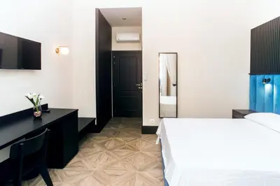 Letto o letti in una camera di FiDa Rooms