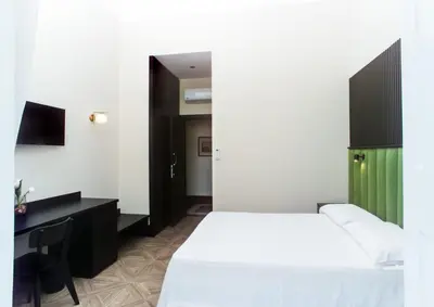 Letto o letti in una camera di FiDa Rooms