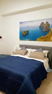 Letto o letti in una camera di il Salotto di Chiaia