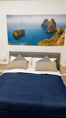 Letto o letti in una camera di il Salotto di Chiaia