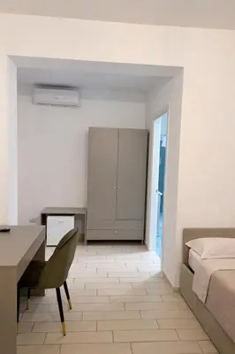 Letto o letti in una camera di VomeRooms