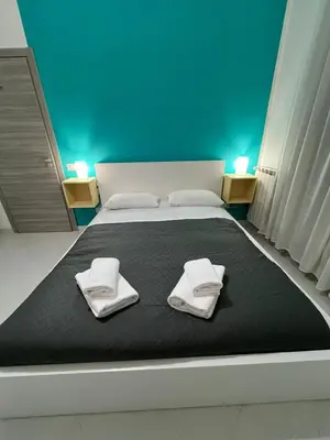 Letto o letti in una camera di Pop Santa Chiara