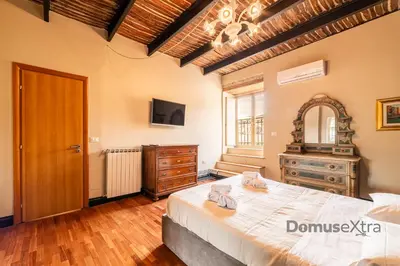 Letto o letti in una camera di Gramsci Relais By DomusExtra