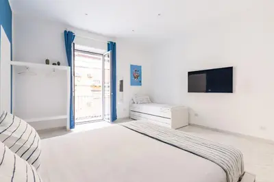 Letto o letti in una camera di White&Blue Apartment at Sanità by Wonderful Italy