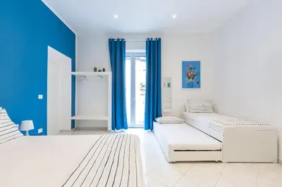Letto o letti in una camera di White&Blue Apartment at Sanità by Wonderful Italy