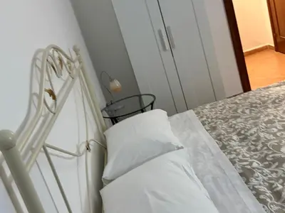 Letto o letti in una camera di Il golfo di Partenope