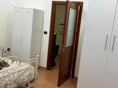 Letto o letti in una camera di Il golfo di Partenope
