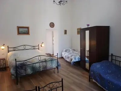 Letto o letti in una camera di B&B Palazzo Sersale Napoli