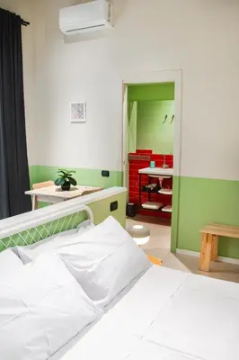 Letto o letti in una camera di B&B Capriccio Napoli