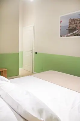 Letto o letti in una camera di B&B Capriccio Napoli
