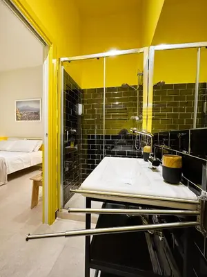 Letto o letti in una camera di B&B Capriccio Napoli