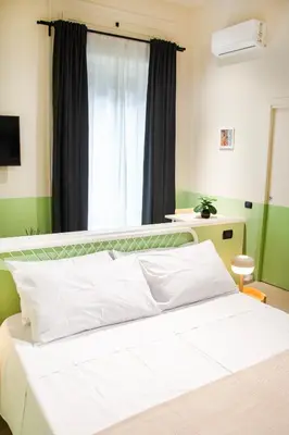 Letto o letti in una camera di B&B Capriccio Napoli