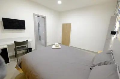 Letto o letti in una camera di B&B Napoli Mitologica