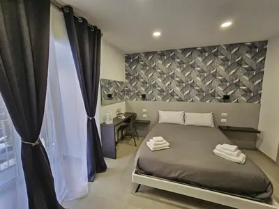 Letto o letti in una camera di B&B Napoli Mitologica