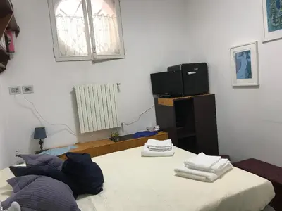 Letto o letti in una camera di Suite del Plebiscito