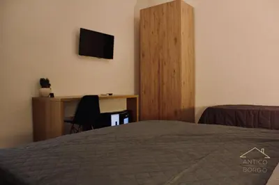 Letto o letti in una camera di Antico Borgo Rooms