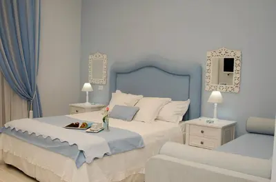Letto o letti in una camera di Domus Rosa