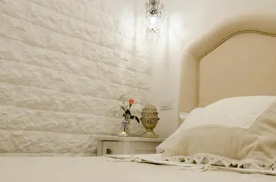 Letto o letti in una camera di Domus Rosa