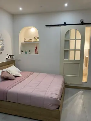 Letto o letti in una camera di La Mea Partenope