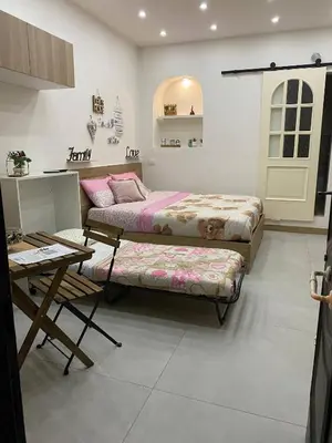 Letto o letti in una camera di La Mea Partenope