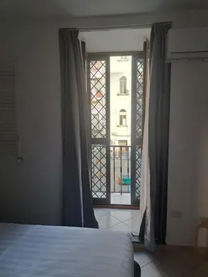 Letto o letti in una camera di Stop al Duomo