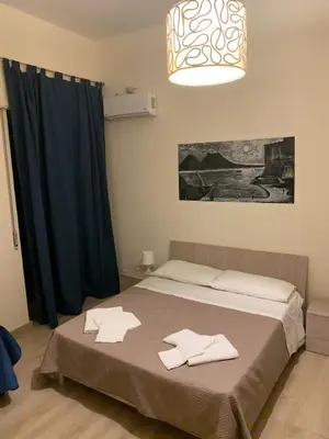 Letto o letti in una camera di Keira house Napoli