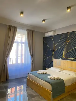 Letto o letti in una camera di Be Italian Flat Sanfelice