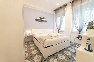 Letto o letti in una camera di Dimora de' Marinari