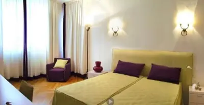 Letto o letti in una camera di Residence gli Angioini srl