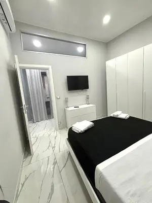 Letto o letti in una camera di Masaniellohouse