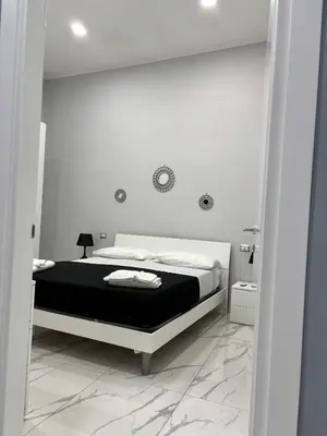 Letto o letti in una camera di Masaniellohouse