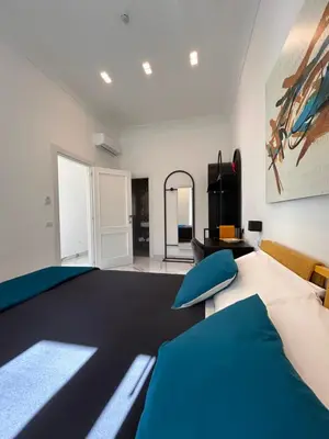Letto o letti in una camera di Napoli Oltre Rooms
