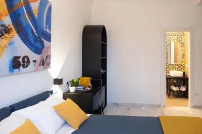 Letto o letti in una camera di Napoli Oltre Rooms