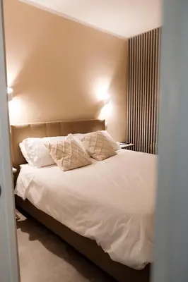 Letto o letti in una camera di ADOUNIA HOME