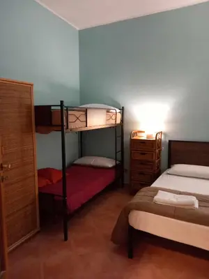 Letto o letti in una camera di Casetta Palmarice Centro Storico