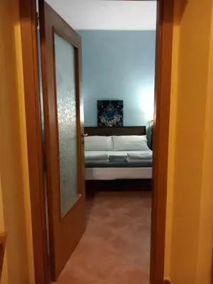 Letto o letti in una camera di Casetta Palmarice Centro Storico
