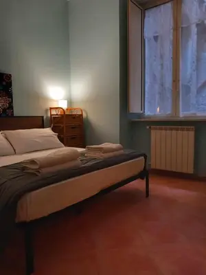 Letto o letti in una camera di Casetta Palmarice Centro Storico