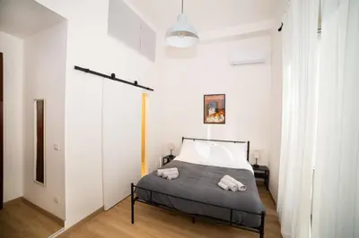 Letto o letti in una camera di B&B 4CELLA