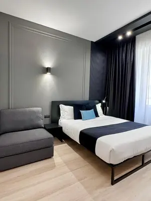 Letto o letti in una camera di Gallerie Boutique Rooms