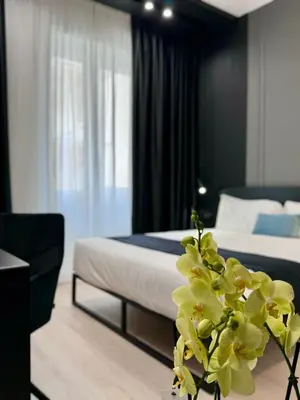 Letto o letti in una camera di Gallerie Boutique Rooms