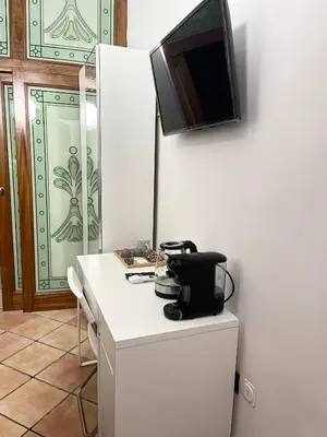 TV o dispositivi per l'intrattenimento presso House Caracciolo by Loveinthetravel