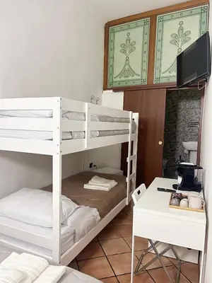 Letto o letti in una camera di House Caracciolo by Loveinthetravel